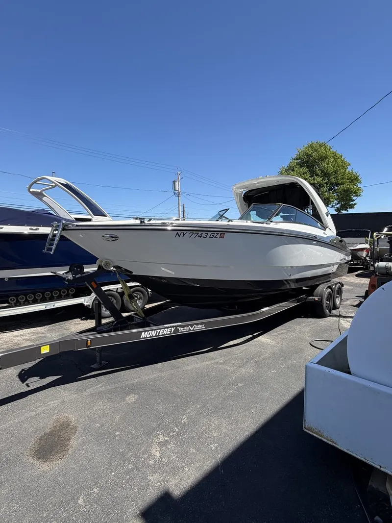 The Image of 2018 Monterey SS 298SS boat on trailer under blue sky. - 1