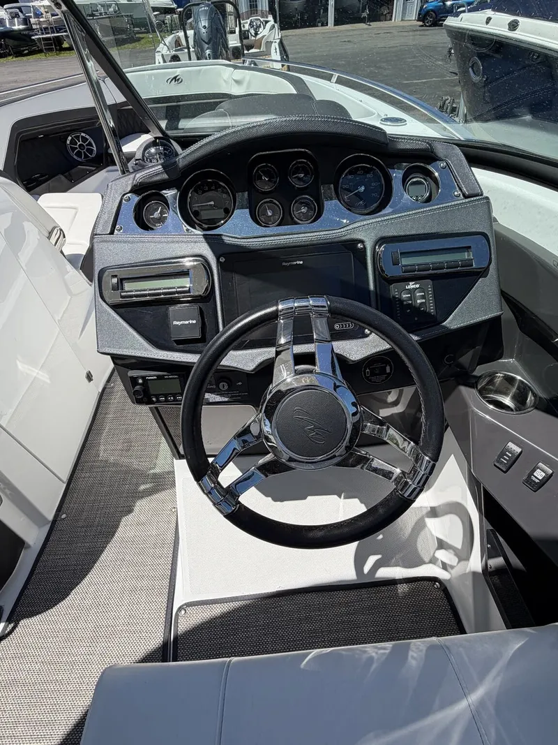 Slide: The Image of Cockpit of a 2018 Monterey SS 298SS boat with steering wheel and instruments. - 10