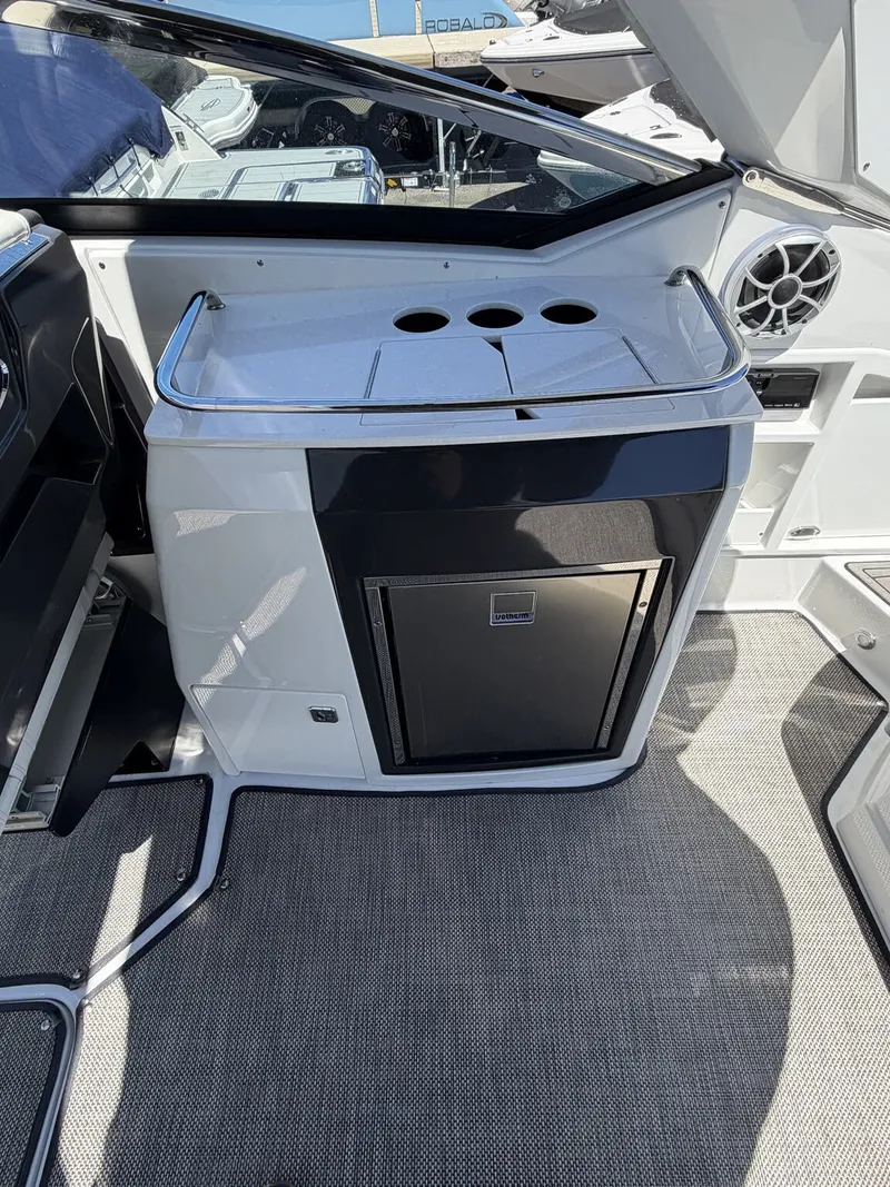 Slide: The Image of Interior of a 2018 Monterey SS 298SS boat with refrigerator. - 12