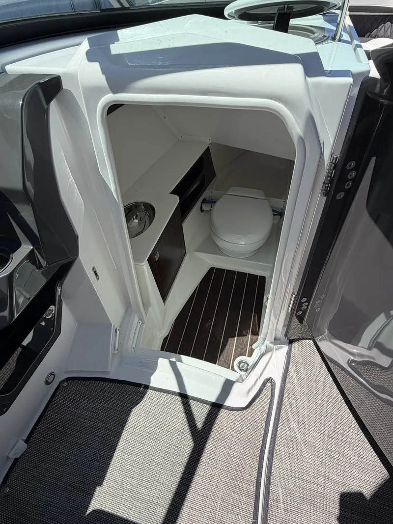 Slide: The Image of Interior of a 2018 Monterey SS 298SS with toilet and sink. - 14