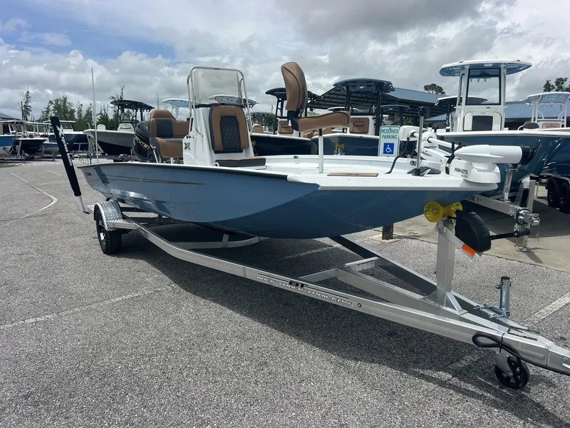 The Image of 2026 Xpress H20B Bay boat on trailer outdoors. - 1