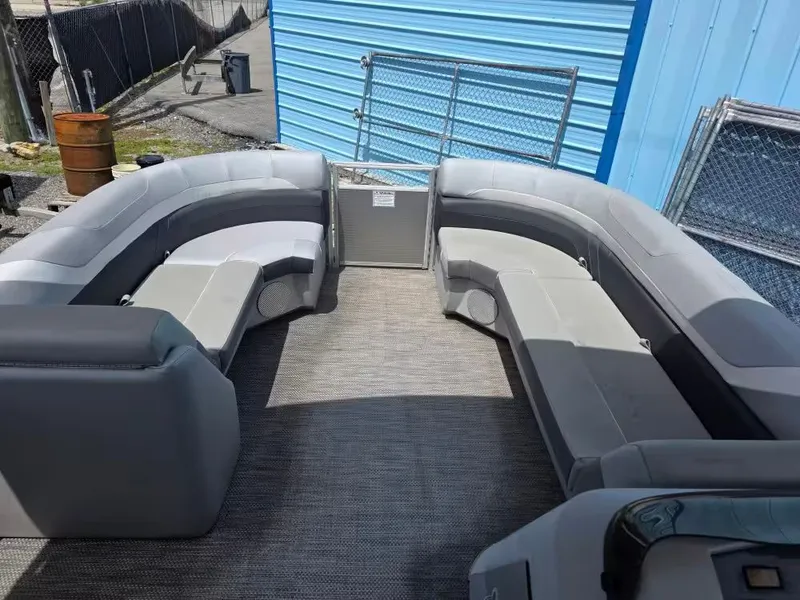 Slide: The Image of Interior of a 2021 Bennington 22SSX pontoon boat with gray seating. - 11