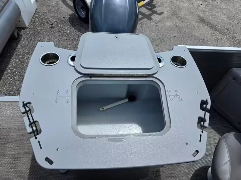 Slide: The Image of Bennington 22SSX 2021 boat console with storage and cup holders. - 5