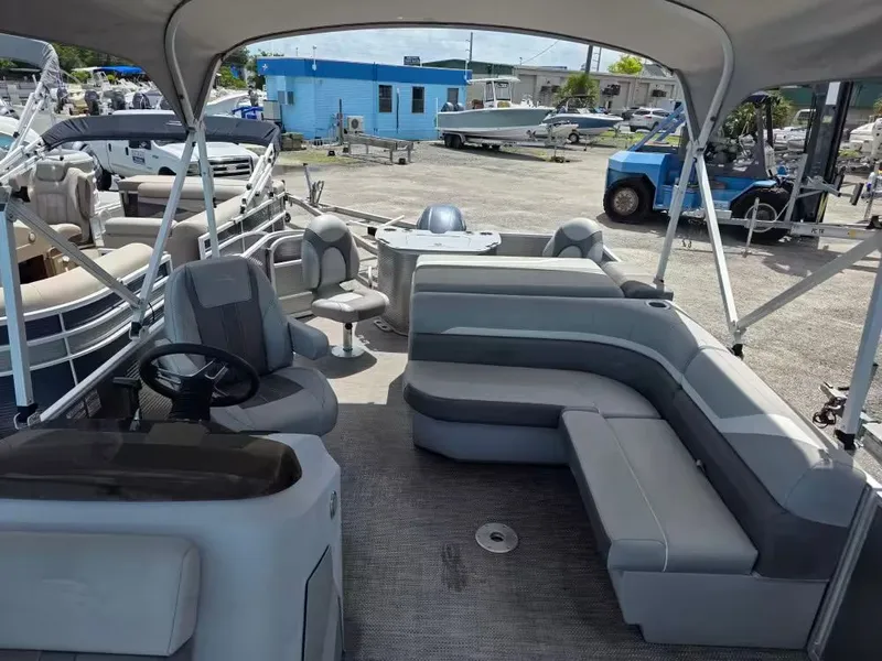 Slide: The Image of Interior of a 2021 Bennington 22SSX pontoon boat with gray seating. - 6