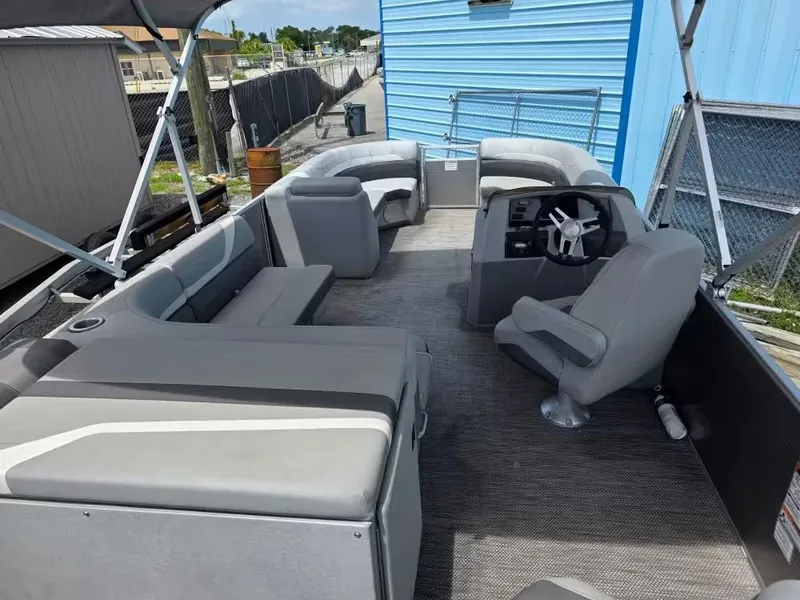 Slide: The Image of Interior of a 2021 Bennington 22SSX pontoon boat with gray seating. - 8