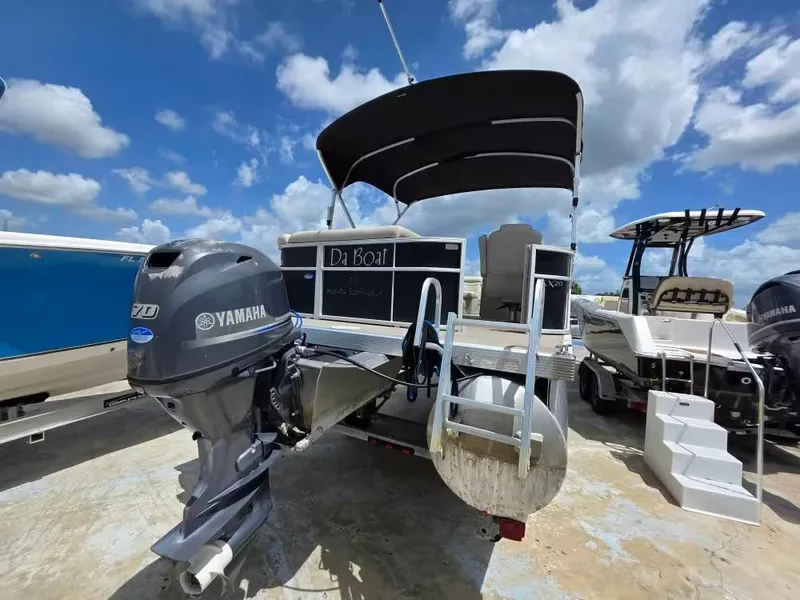 Slide: The Image of 2016 Bennington SX20 pontoon boat with Yamaha engine, sunny sky. - 4
