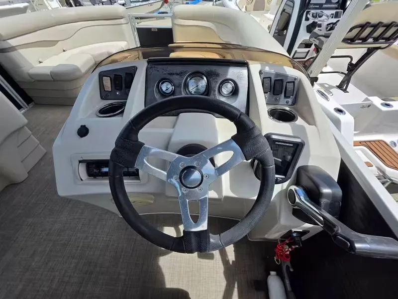 Slide: The Image of Interior view of 2016 Bennington SX20 helm with steering wheel and gauges. - 7