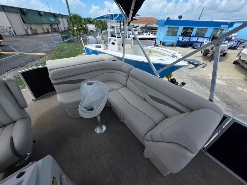 Slide: The Image of Interior of a 2016 Bennington SX20 pontoon boat with gray seating. - 8