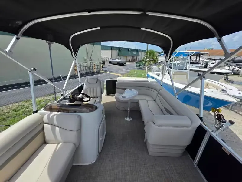 Slide: The Image of Interior of a 2016 Bennington SX20 pontoon boat with seating. - 9