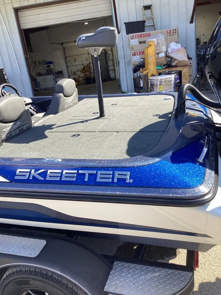 Slide: The Image of 2019 Skeeter ZX225 boat parked in a workshop. - 17