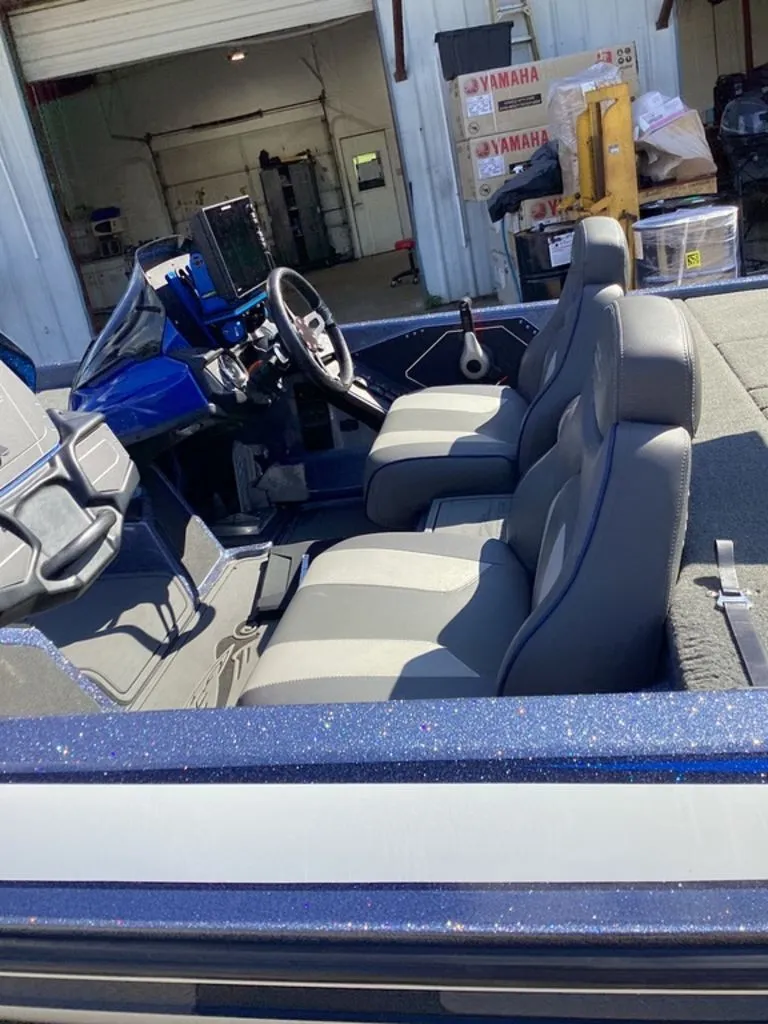 Slide: The Image of Interior of a 2019 Skeeter ZX225 boat with gray seats. - 18