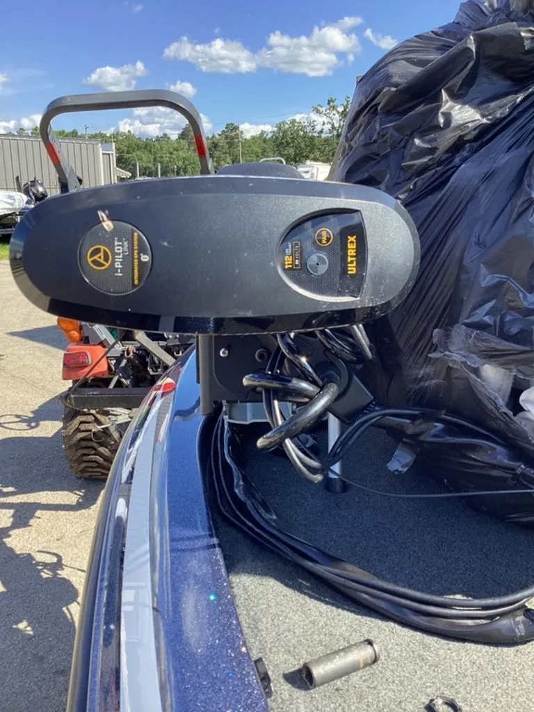 Slide: The Image of Skeeter ZX225 2019 with Minn Kota Ultrex motor on a sunny parking lot. - 22