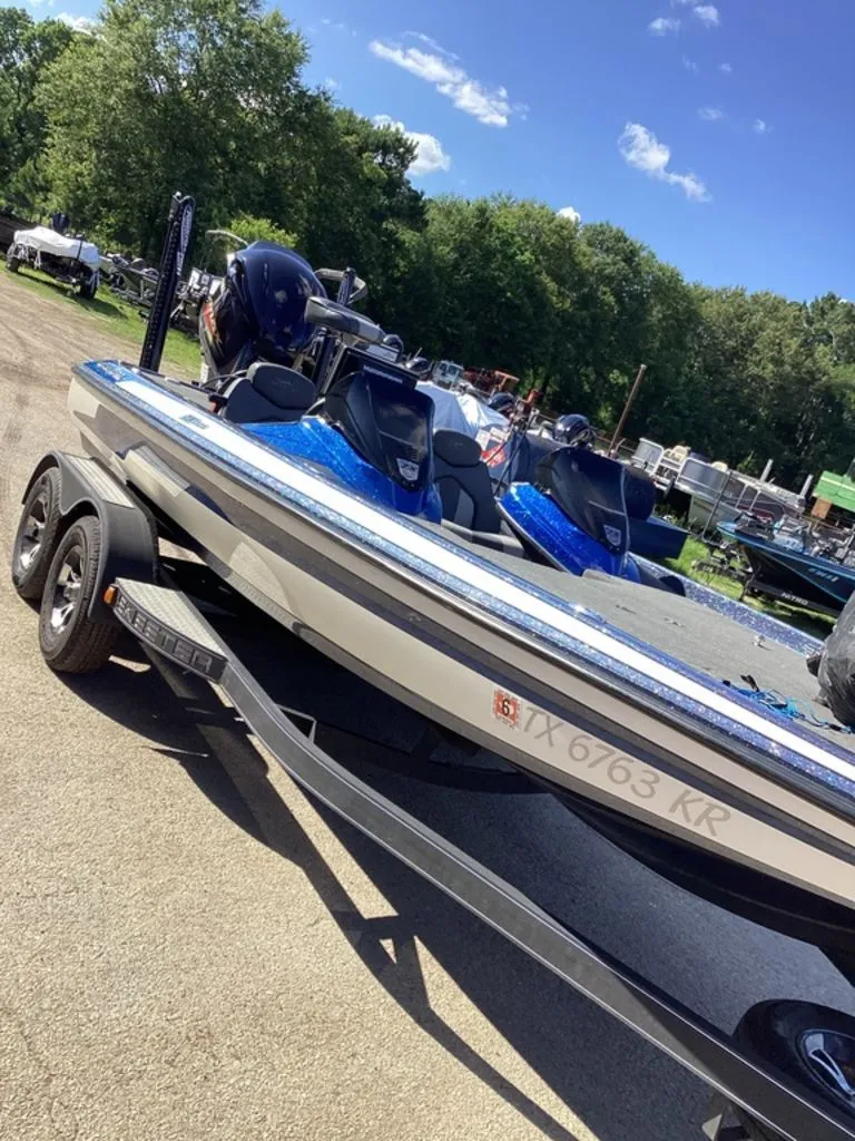 Slide: The Image of 2019 Skeeter ZX225 boat on trailer outdoors. - 3