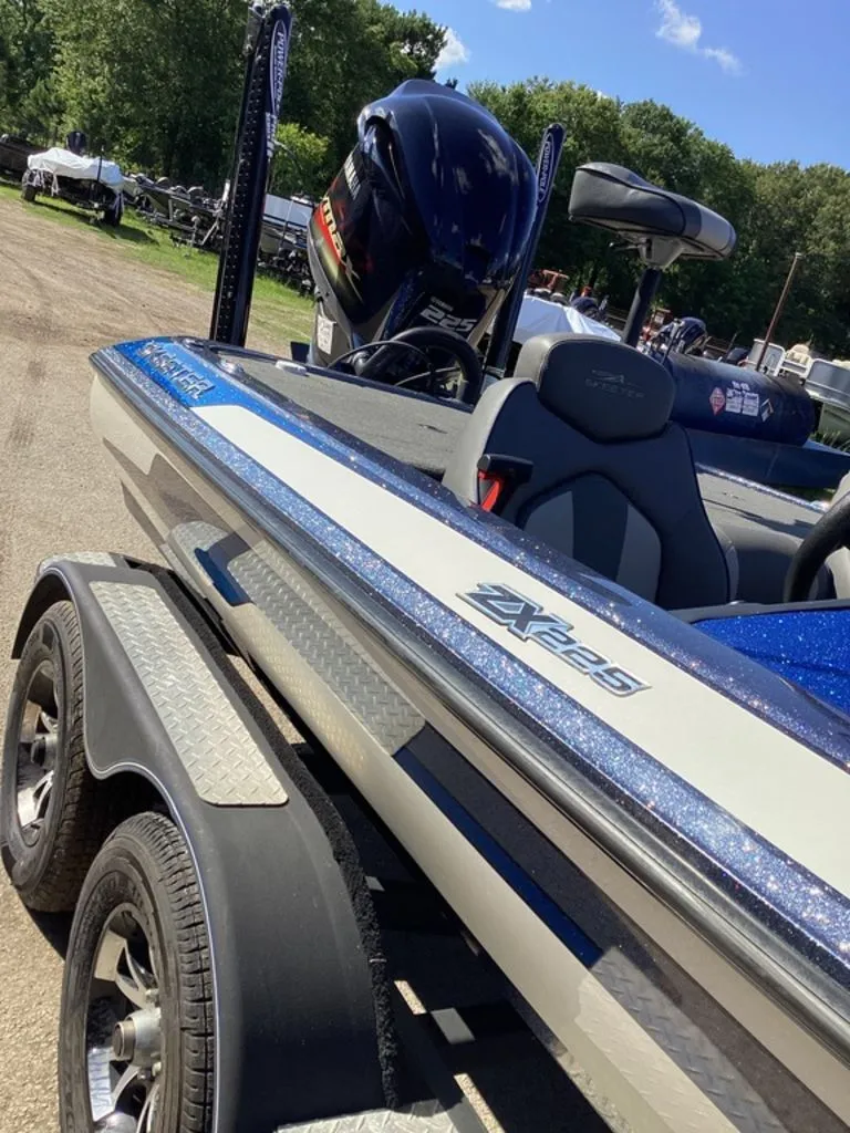 Slide: The Image of 2019 Skeeter ZX225 boat on trailer, sunny day. - 6