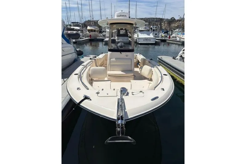 Slide: The Image of 2023 Grady-White Fisherman 236 boat docked in marina, featuring Garmin equipment. - 2