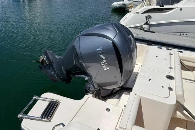 Slide: The Image of 2023 Grady-White Fisherman 236 boat with Yamaha outboard motor on calm water. - 3