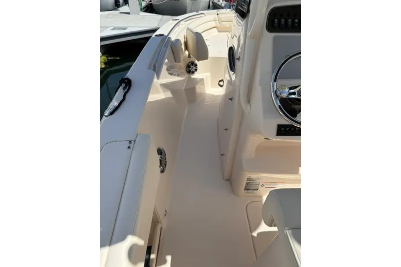 Slide: The Image of 2023 Grady-White Fisherman 236 boat interior with steering wheel and seating. - 7