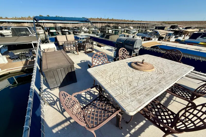 Slide: The Image of Rooftop deck of 1986 Hilburn 4014 Executive houseboat with patio furniture and grill. - 21