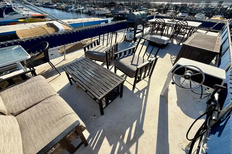 Slide: The Image of Rooftop deck of 1986 Hilburn 4014 Executive houseboat with seating and grill. - 23