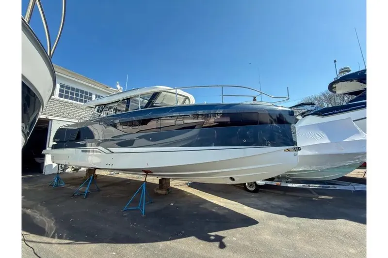 The Image of 2026 Wellcraft 44 Explorer yacht in dry dock, sunny day. - 1