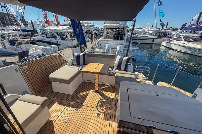 Slide: The Image of Wellcraft 44 Explorer 2026 at a boat show. - 5