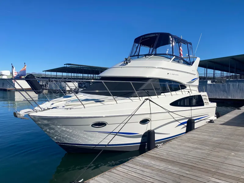 The Image of 2007 Carver 36 Sedan Yacht docked on a sunny day. - 0