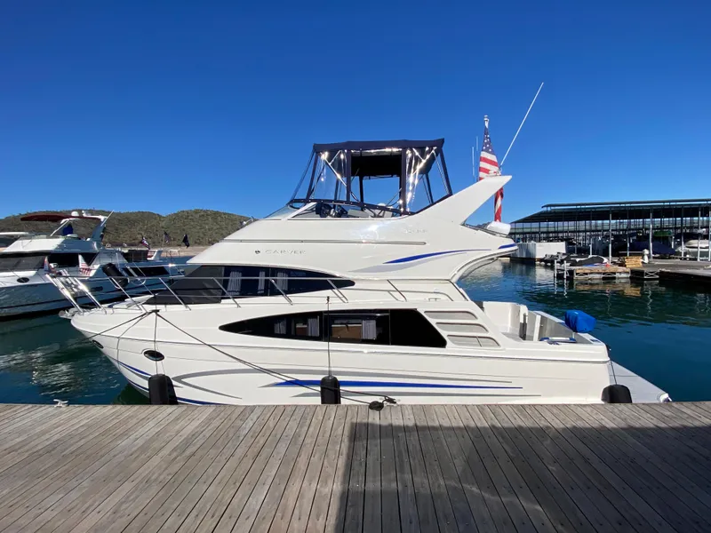 Slide: The Image of 2007 Carver 36 Sedan Yacht docked under clear blue sky. - 1