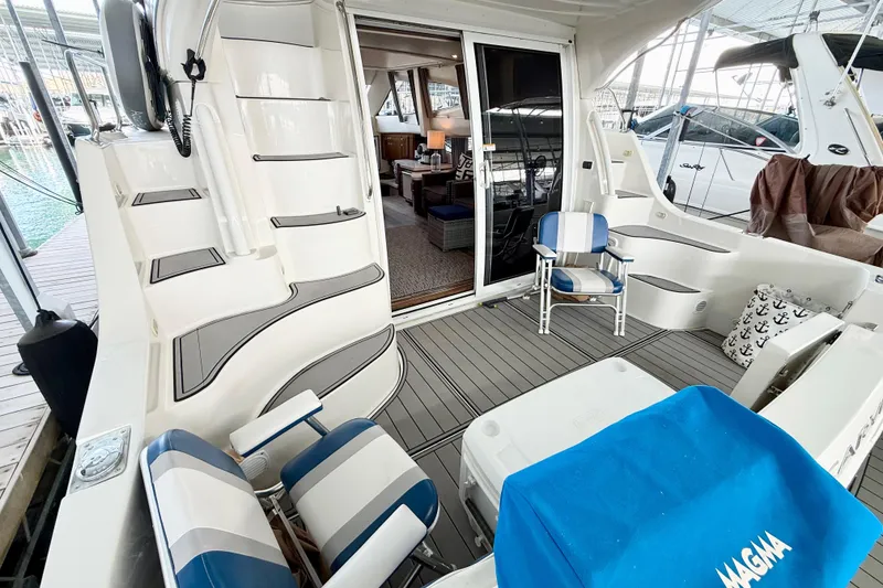 Slide: The Image of 2007 Carver 36 Sedan yacht interior with seating, steps, and open cabin view. - 13