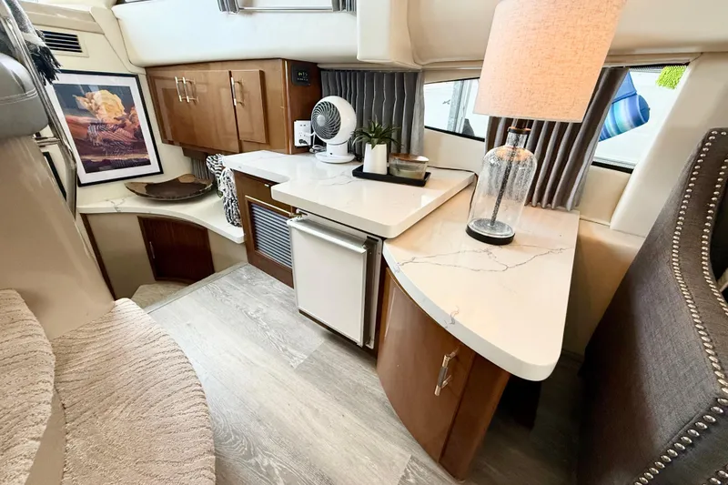 Slide: The Image of Interior of a 2007 Carver 36 Sedan yacht with modern decor and amenities. - 21