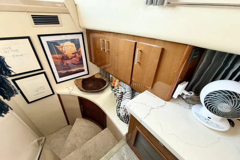 Slide: The Image of Interior of 2007 Carver 36 Sedan with modern decor and framed artwork. - 24