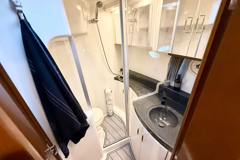 Slide: The Image of Luxurious bathroom in a 2007 Carver 36 Sedan yacht, featuring modern fixtures and sleek design. - 27