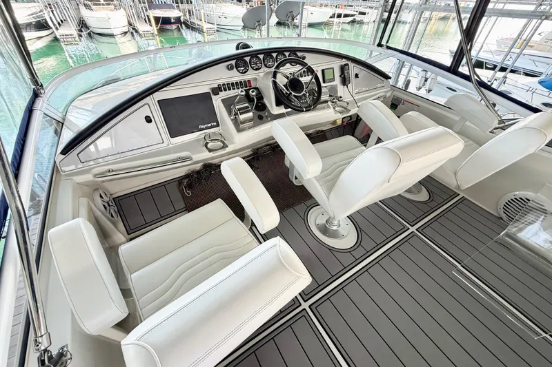 Slide: The Image of Luxurious helm of a 2007 Carver 36 Sedan yacht with modern controls and seating. - 35