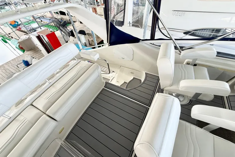 Slide: The Image of Luxurious interior of a 2007 Carver 36 Sedan yacht with white seating and sleek flooring. - 37