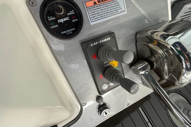Slide: The Image of Control panel of a 2007 Carver 36 Sedan boat with Side-Power thruster controls. - 40