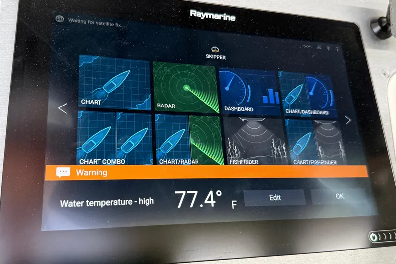 Slide: The Image of Raymarine display on 2007 Carver 36 Sedan showing high water temperature warning at 77.4°F. - 42