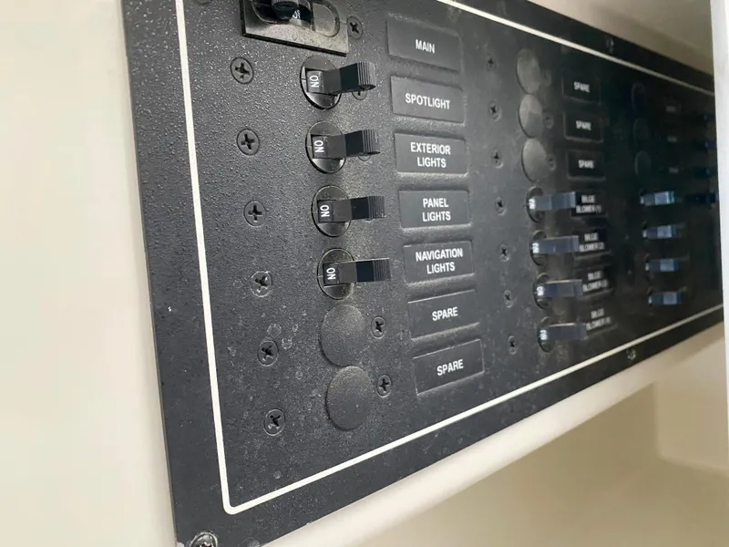 Slide: The Image of Control panel of a 2007 Carver 36 Sedan with light switches. - 45