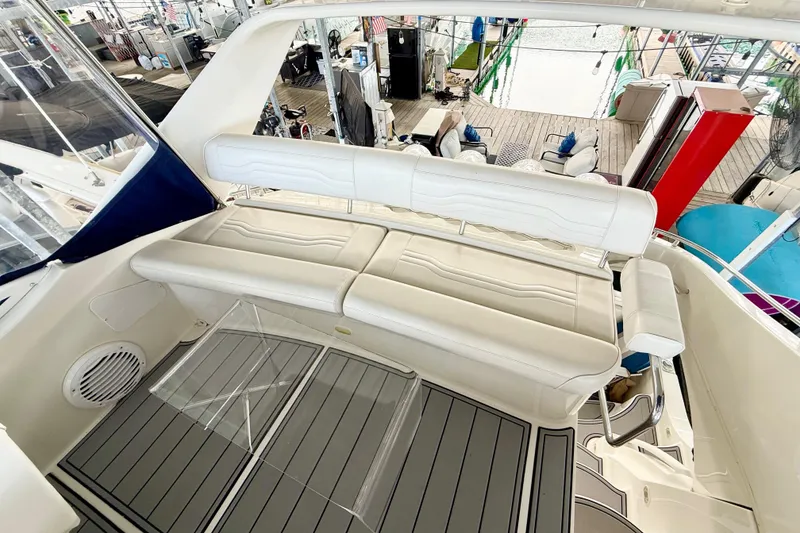Slide: The Image of 2007 Carver 36 Sedan yacht interior with white seating and sleek design. - 48