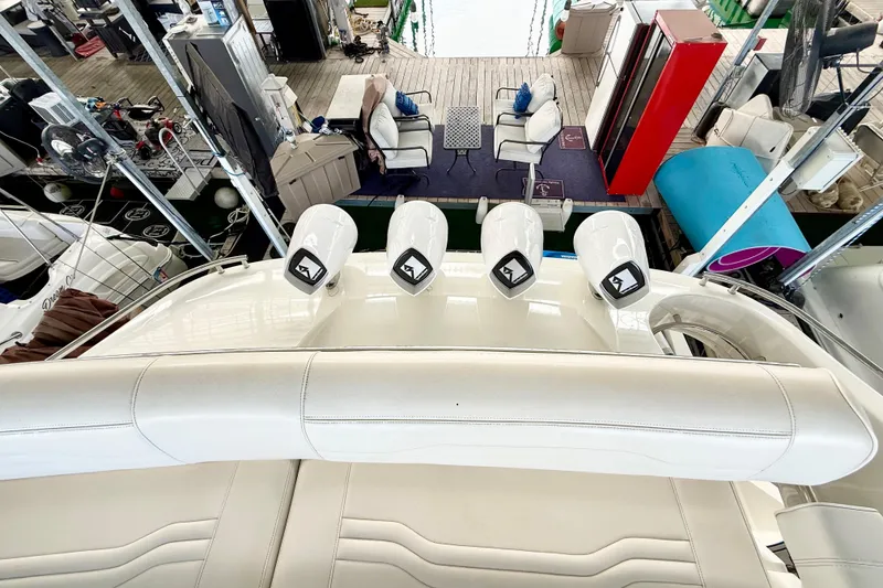 Slide: The Image of 2007 Carver 36 Sedan yacht interior with white seating and dock view. - 52