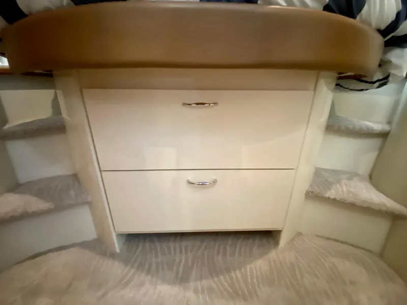 Slide: The Image of Interior of 2007 Carver 36 Sedan with drawers and carpet. - 8