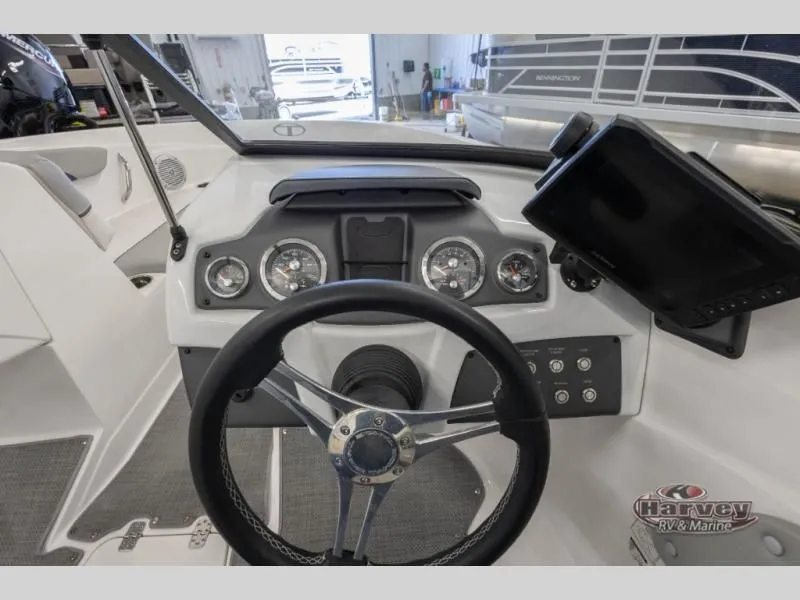 Slide: The Image of Interior view of 2022 Tahoe 210SI boat cockpit with controls. - 12
