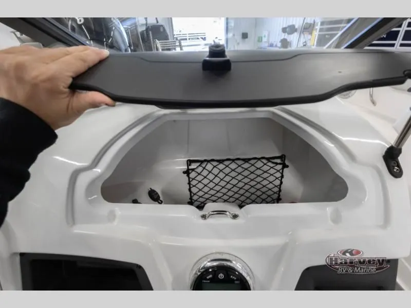 Slide: The Image of Storage compartment in 2022 Tahoe 210SI boat with netting. - 16