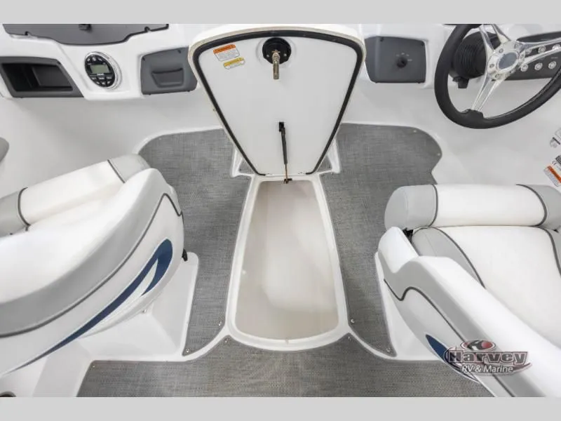 Slide: The Image of Interior of 2022 Tahoe 210SI boat with gray carpet flooring. - 19