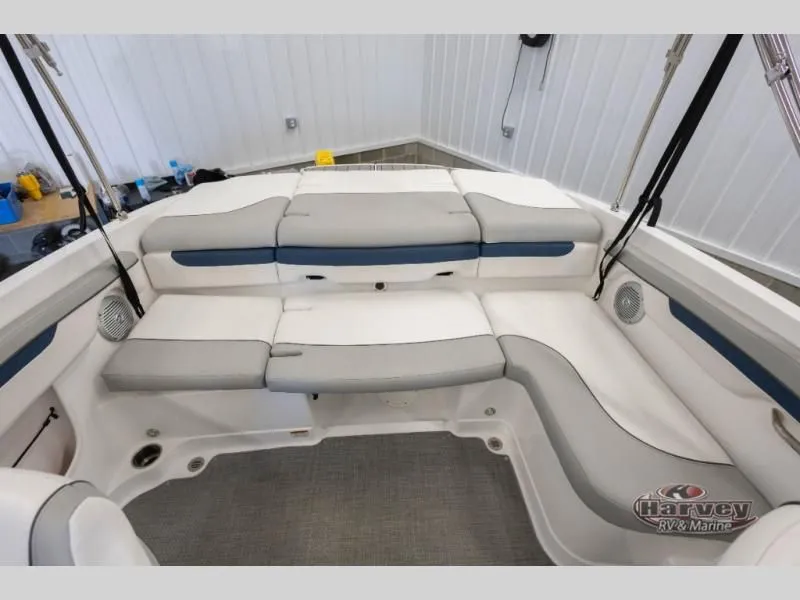 Slide: The Image of Interior of a 2022 Tahoe 210SI boat with gray and blue seating. - 20