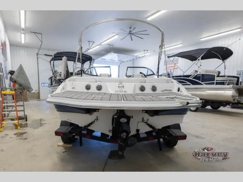 Slide: The Image of 2022 Tahoe 210SI boat in a workshop, rear view. - 3