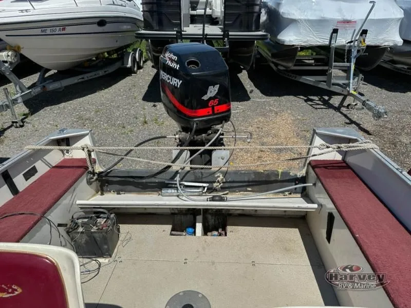 Slide: The Image of 2002 Hudson 19 DLX boat with Mercury engine outdoors. - 11
