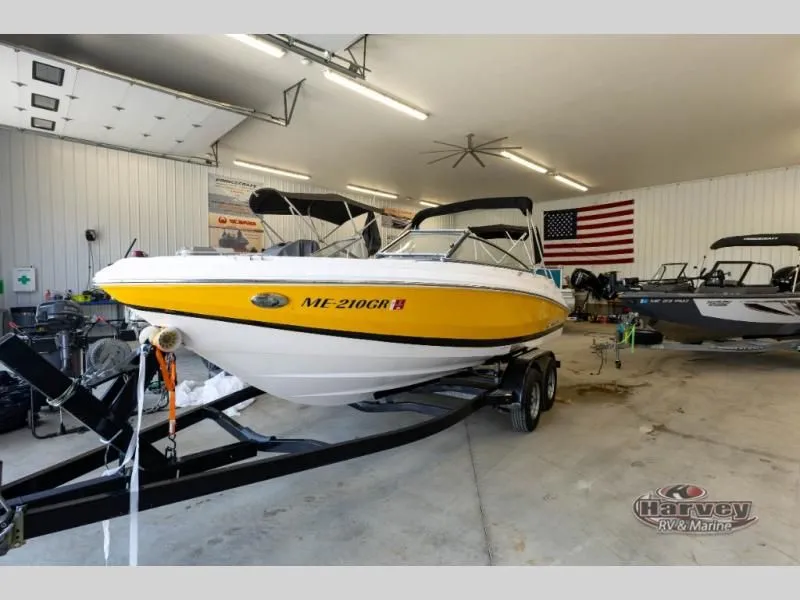 The Image of Yellow 2014 Regal 2000 boat in a workshop. - 1
