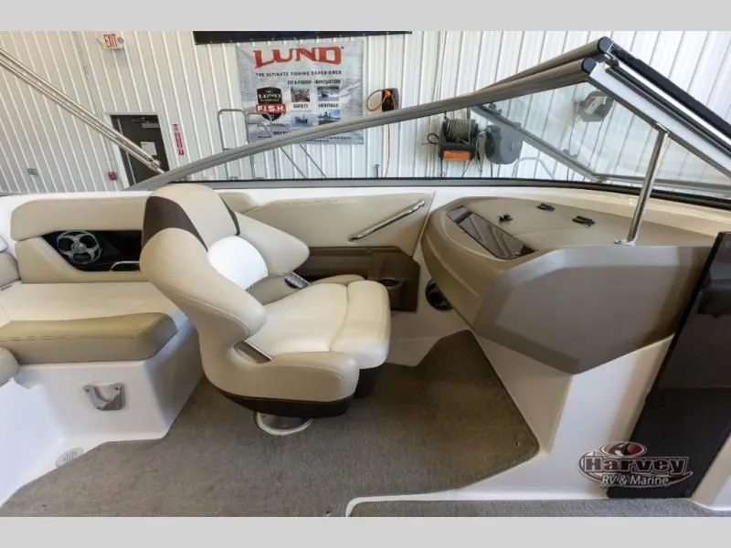 Slide: The Image of Interior of a 2014 Regal 2000 boat with beige seating. - 13