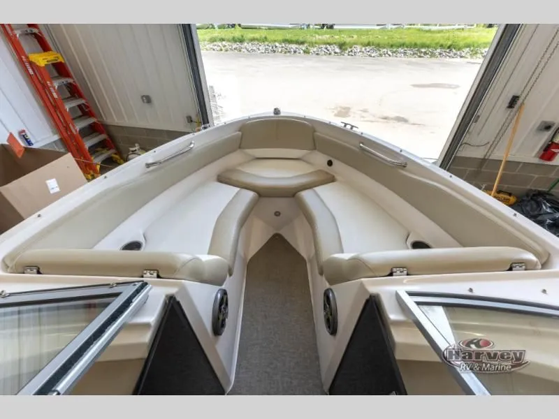 Slide: The Image of Interior view of a 2014 Regal 2000 boat in a garage. - 15