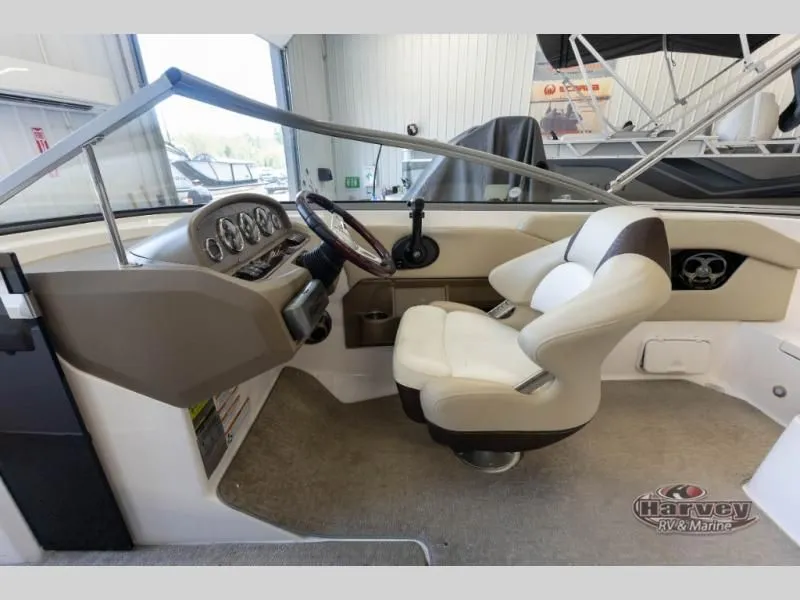 Slide: The Image of Interior of a 2014 Regal 2000 boat with steering console. - 19