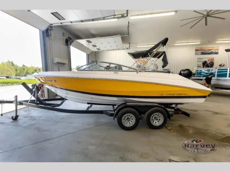 Slide: The Image of Yellow 2014 Regal 2000 boat in a workshop. - 2